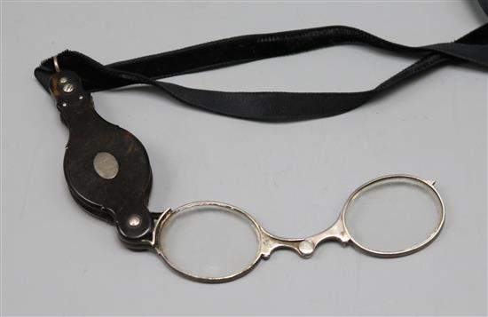 A pair of silver and tortoiseshell lorgnettes